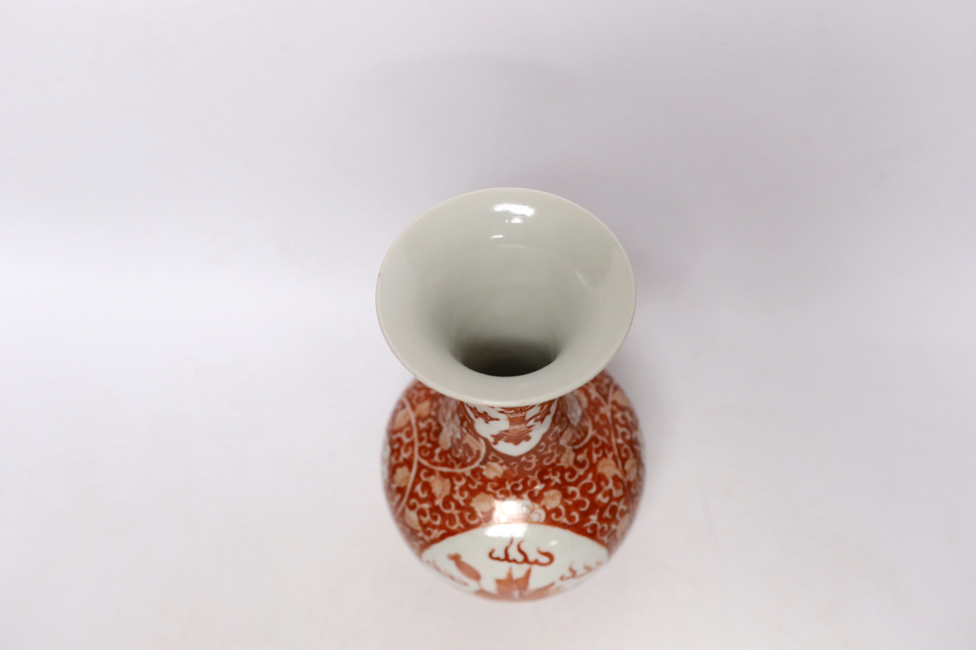 A Chinese iron red enamelled 'mythical beast' vase, early 20th century, 21cm high